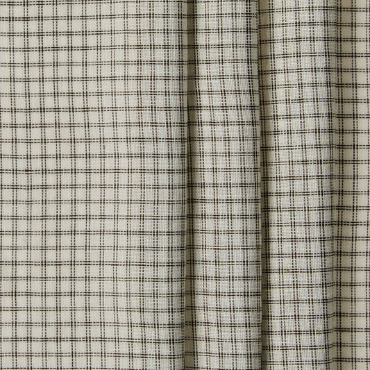Close-up of a fabric with a subtle check pattern on a neutral background